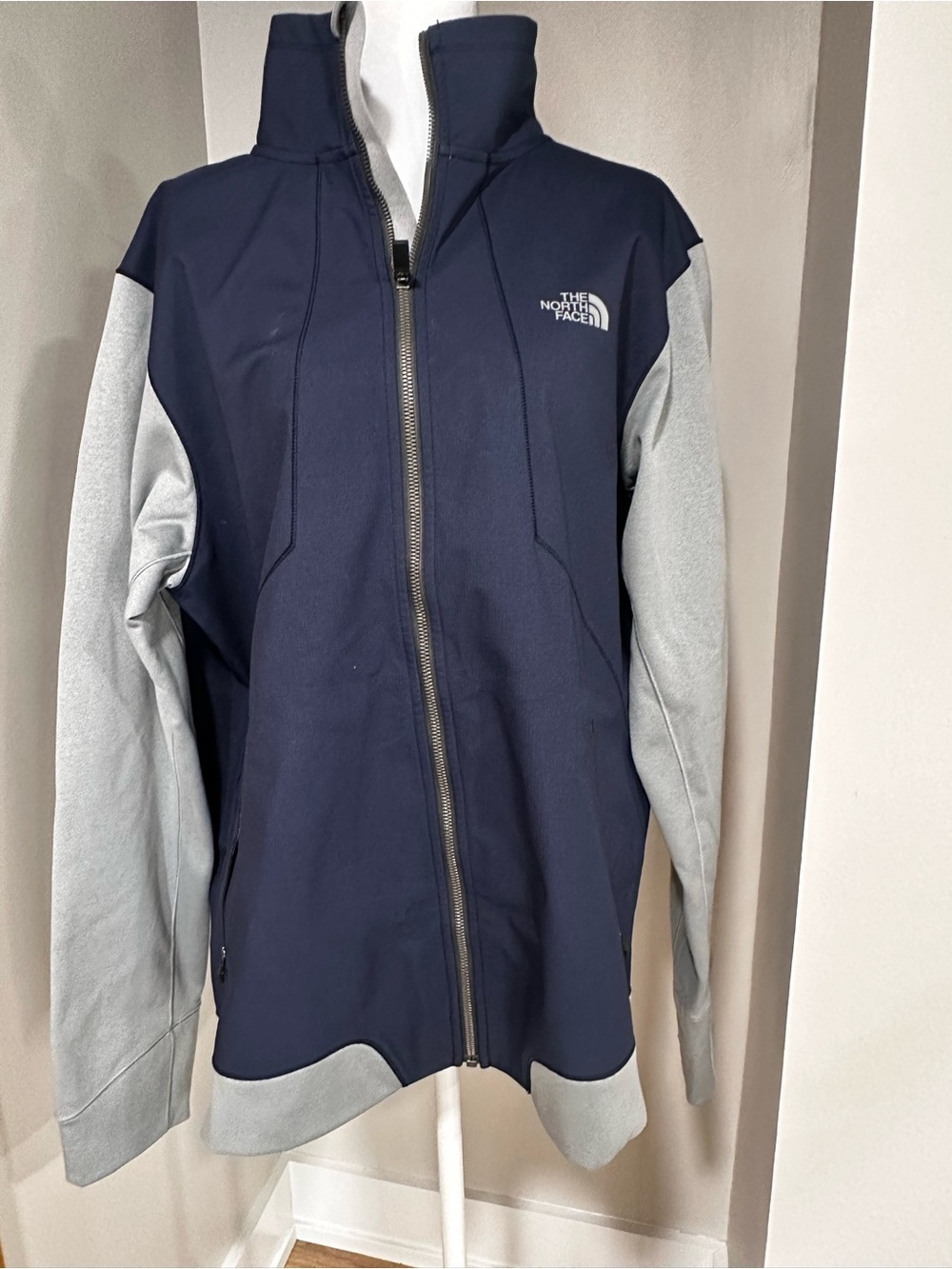 The North Face Navy with Light Gray Sleeve Softshell Jacket. Size L.